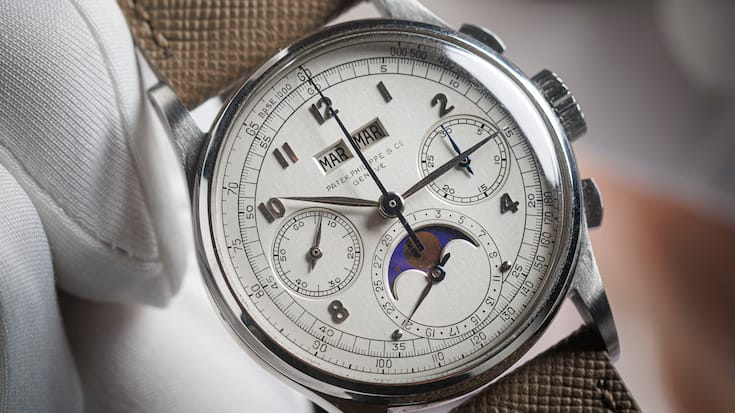 This photograph shows a rare Patek Philippe - Reference 1518 steel watch manufactured in 1943 and expected to fetch more than 10 million dollars at the Phillips auction house in Geneva on November 8, 2025. (Photo by Valentin Flauraud / AFP)