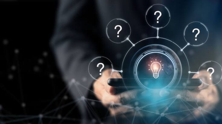 Question marks and light bulb symbolizing idea or solution. Problem solving skill, creativity, innovation, brainstorming, critical thinking and root cause analysis concept. Question, idea and answer.