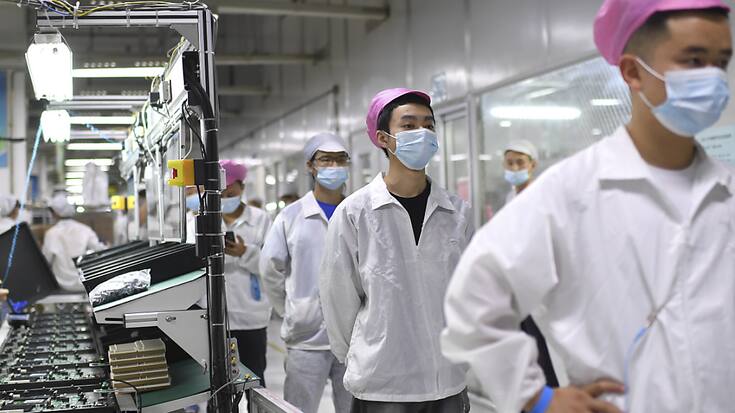 Pendant 56 jours, les  200'000 personnes travaillant dans l'iPhone City de Foxconn n'étaient autorisées à se déplacer entre leurs dortoirs et leur lieu de travail qu'à bord de navettes spécifiques. (archives)