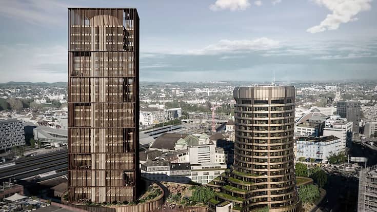 Située à deux pas de la gare CFF de Bâle, la future tour, d'une hauteur de 107 mètres, dominera le bâtiment principal actuel.