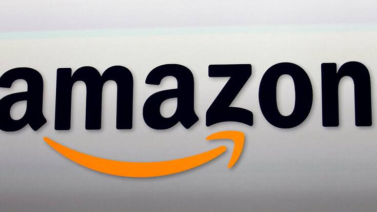 Les grévistes d'Amazon demandent notamment un salaire horaire de 15 livres (17,6 euros). (AP Photo/Reed Saxon, File)
