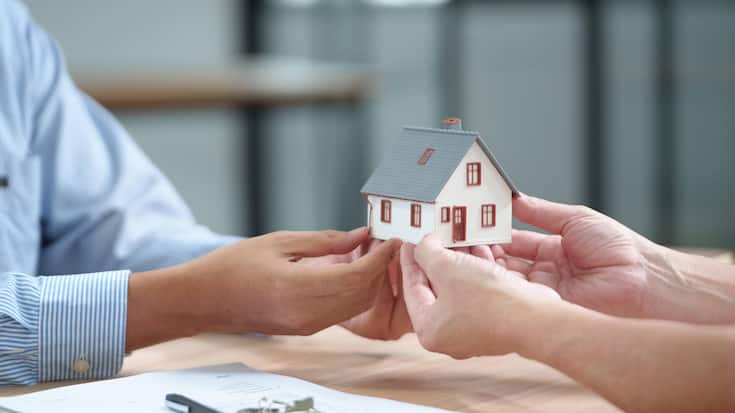 Real Estate Deal with House Model, Documents and Keys