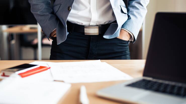 businessman-standing-in-his-office-picjumbo-com-scaled