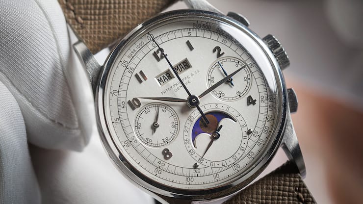 This photograph shows a rare Patek Philippe - Reference 1518 steel watch manufactured in 1943 and expected to fetch more than 10 million dollars at the Phillips auction house in Geneva on November 8, 2025. (Photo by Valentin Flauraud / AFP)