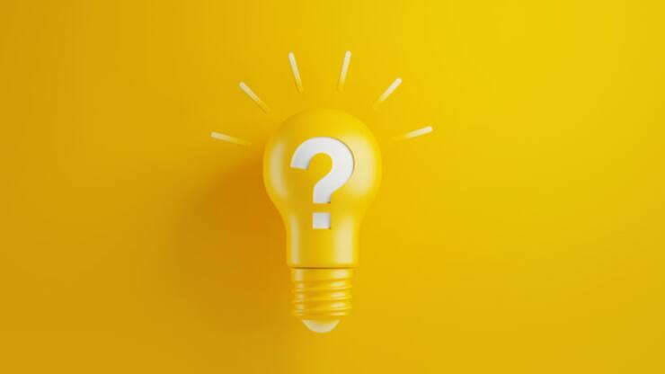 Light bulb on yellow background. There is a question mark on the lightbulb. Horizontal composition with copy space. Creativity and innovation concept.
