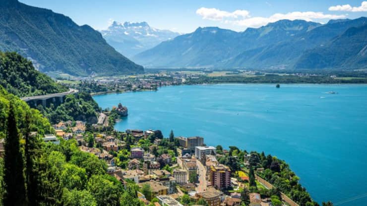 Aerial view of Geneva lake with Swiss Alps panorama from Montreux to Villeneuve and Chillon castle in Veytaux city Vaud Switzerland