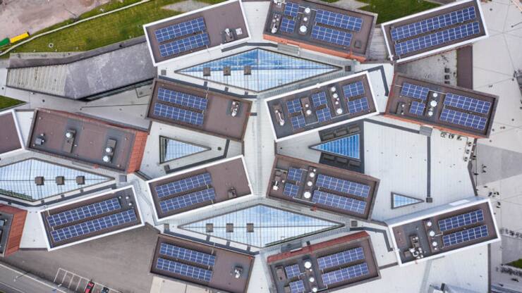 Espoo, Finland - September 11, 2020: Aerial view of the brand new Aalto university campus. Modern nordic architecture. The solar panels mounted on the roof.