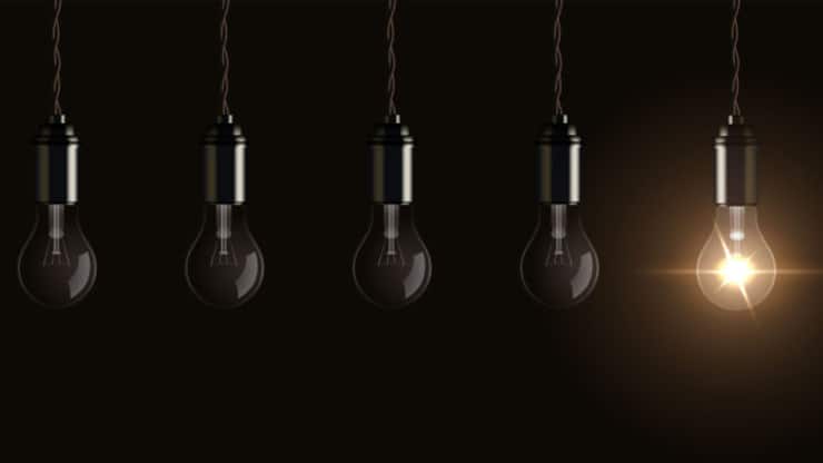 Light bulbs hang from ceiling vector illustration. Realistic 3d glass electric lamps with one bright lightbulb glowing, symbol of creative innovation, energy of inspiration on dark background