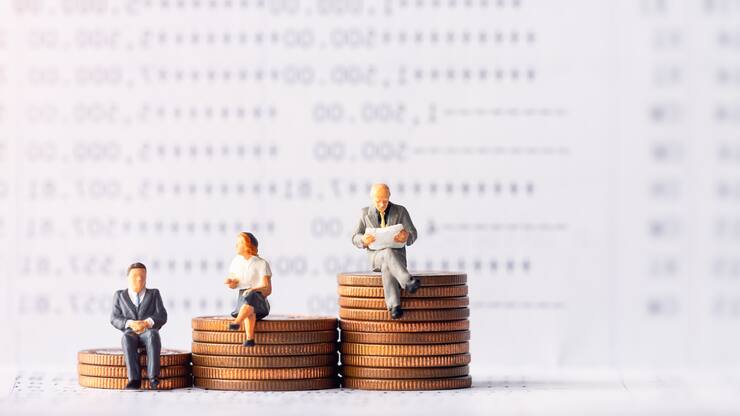 Miniature people: Elderly people sitting on coins stack. Retirement planning. money saving and Investment. Time counting down for retirement and pension.