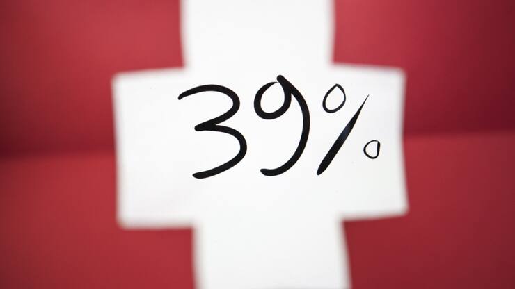 Avec des droits de douane américains de 39%, l'économie suisse devrait ralentir selon Raiffeisen. (archive)