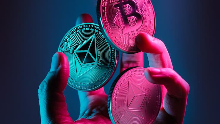 Ethereum,And,Bitcoin,Tokens,Floating,Over,A,Hand,With,Blue