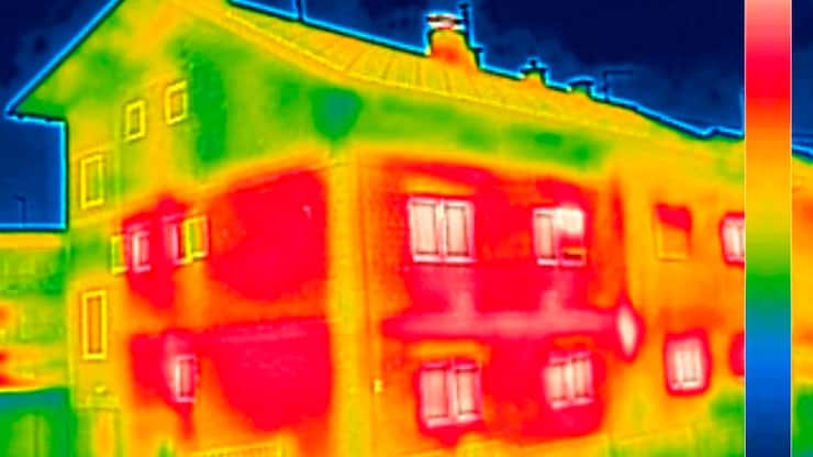 Infrared thermovision image showing lack of thermal insulation on House with or without facade