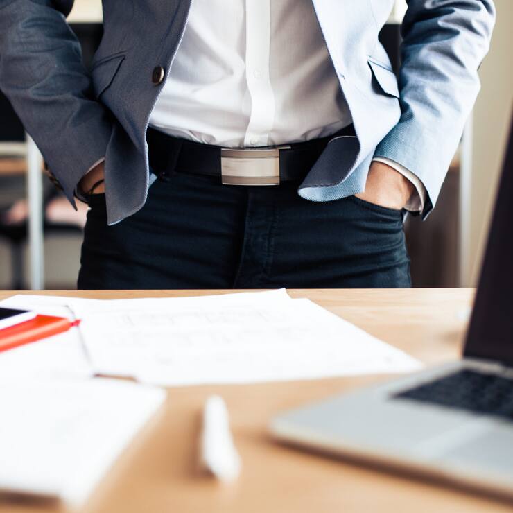 businessman-standing-in-his-office-picjumbo-com-scaled