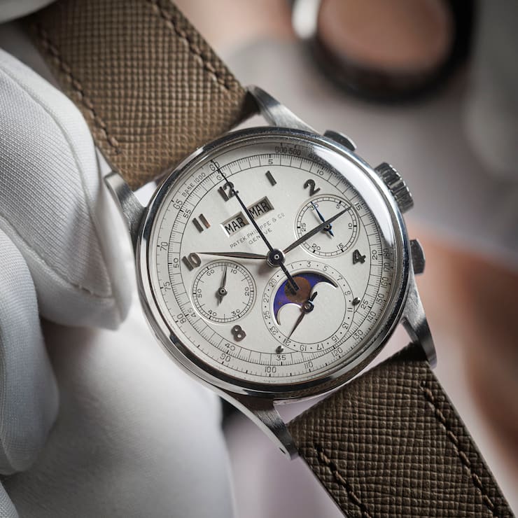 This photograph shows a rare Patek Philippe - Reference 1518 steel watch manufactured in 1943 and expected to fetch more than 10 million dollars at the Phillips auction house in Geneva on November 8, 2025. (Photo by Valentin Flauraud / AFP)
