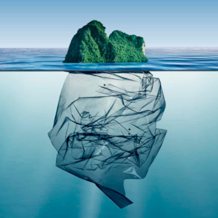 garbage plastic with island floating in the ocean.