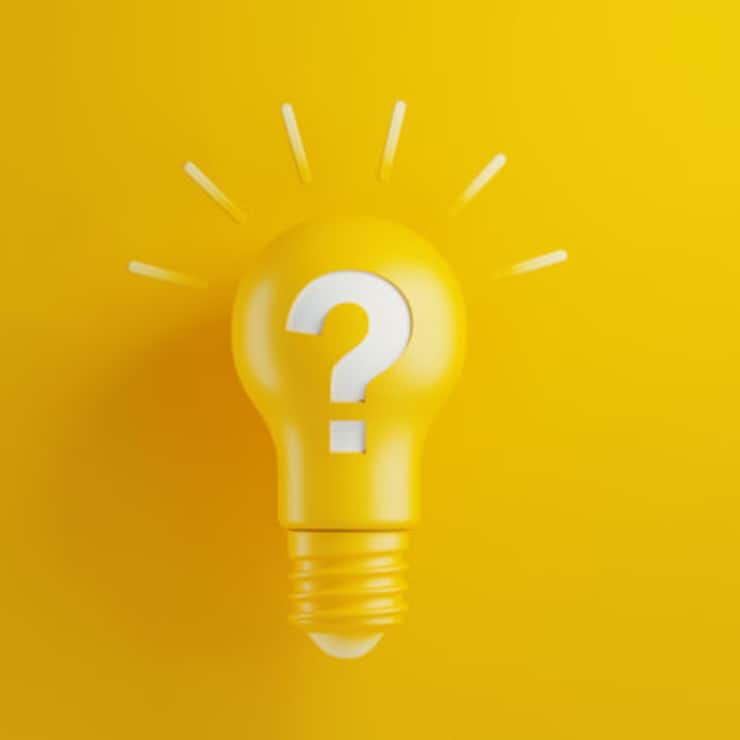 Light bulb on yellow background. There is a question mark on the lightbulb. Horizontal composition with copy space. Creativity and innovation concept.