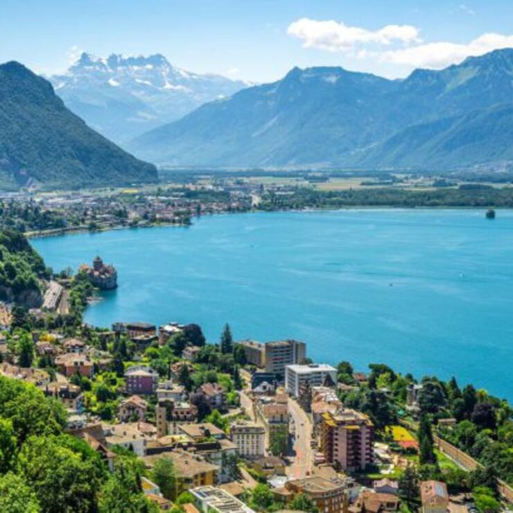 Aerial view of Geneva lake with Swiss Alps panorama from Montreux to Villeneuve and Chillon castle in Veytaux city Vaud Switzerland