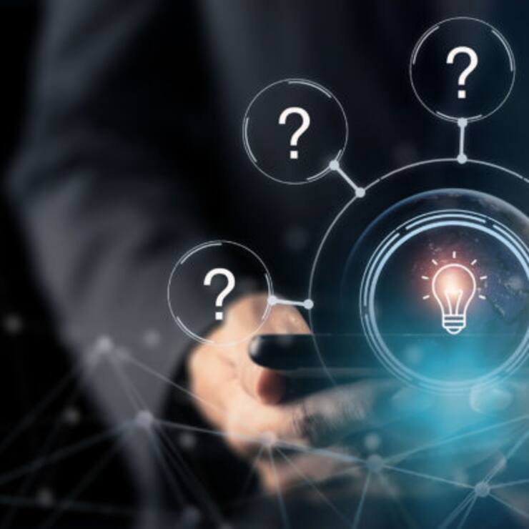 Question marks and light bulb symbolizing idea or solution. Problem solving skill, creativity, innovation, brainstorming, critical thinking and root cause analysis concept. Question, idea and answer.