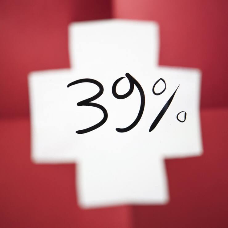 Avec des droits de douane américains de 39%, l'économie suisse devrait ralentir selon Raiffeisen. (archive)